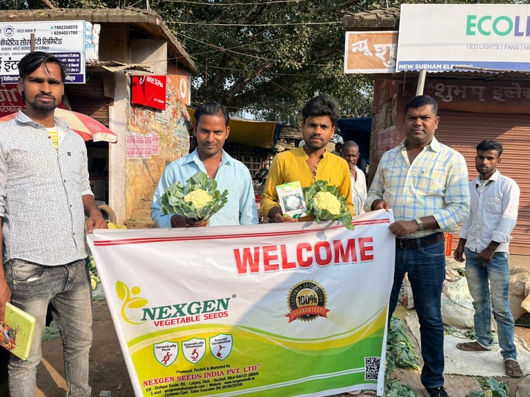 Farmers holding fresh cauliflower and a Nexgen Vegetable Seeds banner at a local Uttarakhand market.