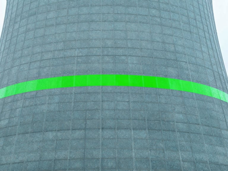 Close-up of a modern cooling tower fill material with water droplets, clean cool-toned daylight, sharp focus, safety green accents.