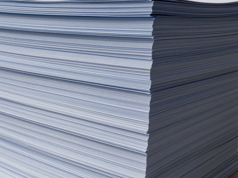 Abstract image of stacked financial documents or ledgers, clean and organized, with subtle architectural lighting.