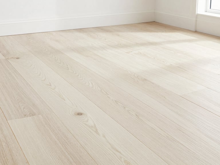Looking down at precision-milled white oak hardwood flooring, straight clean joints, natural grain pattern, bright daylight, sharp focus.