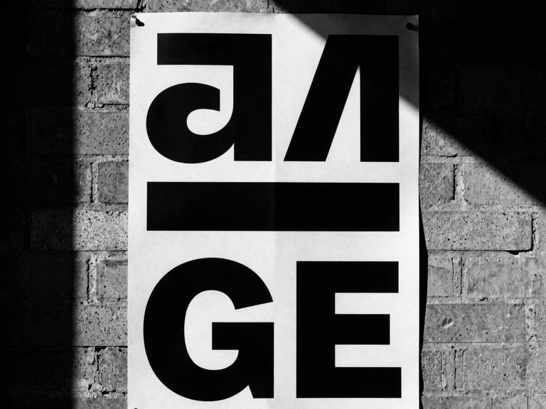 Close-up of a bold monochrome poster pasted on a rough brick wall, harsh sunlight, deep shadows.