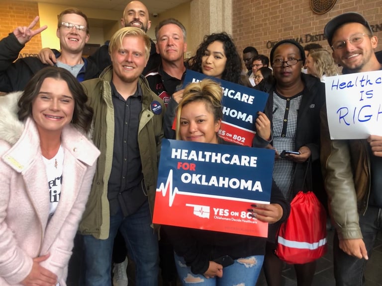 Ray Jarosz poses with some of his crew at the Oklahoma Secretary of State's Office.