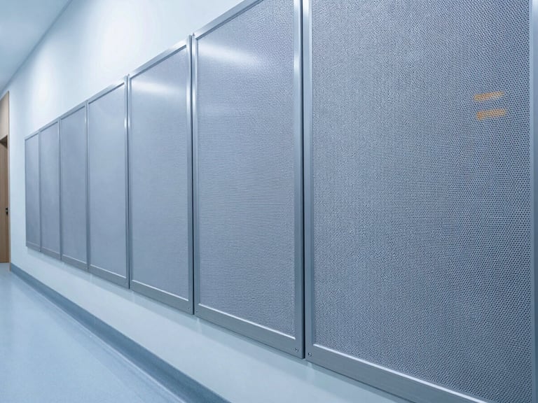 Clean close-up of a hygienic wall protection system installed in a modern hospital corridor, cool-toned architectural lighting, high-contrast, no people.
