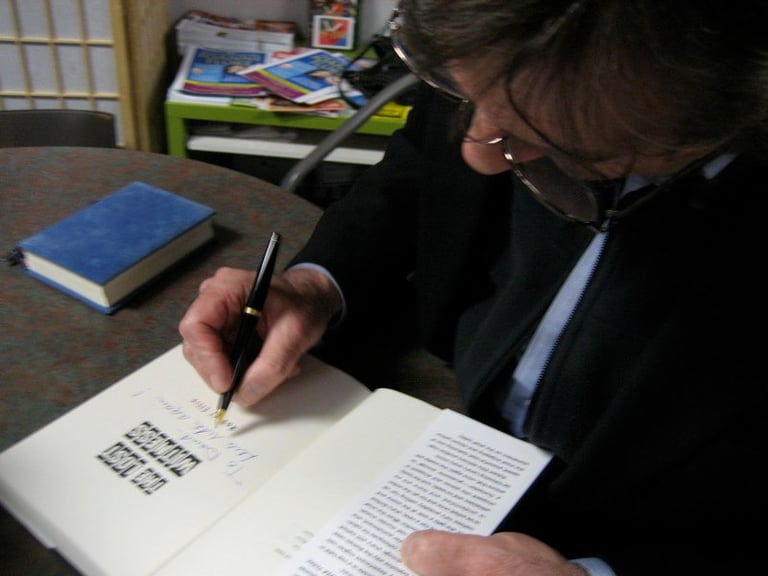 Photo of Robert Ellis, bestselling author signing 'The Lost Witness' at the Mysterious Galaxy in San Diego California.