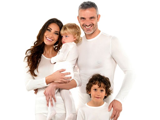 a family of three people standing in front of a white background