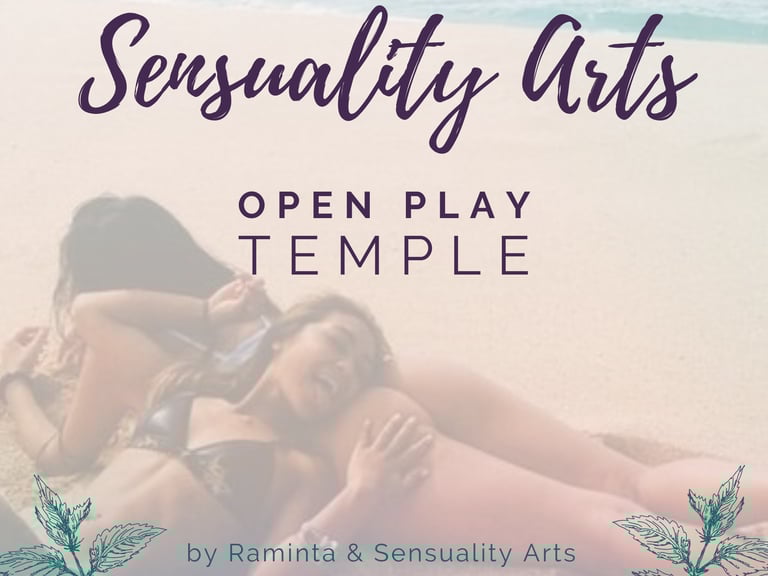 a woman laying on a beach with a woman and woman