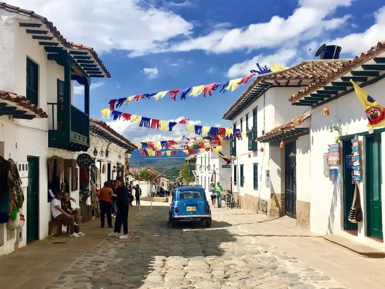 Vibrant view of crowded historic colonial streets with visitors during a private Villa de Leyva tour