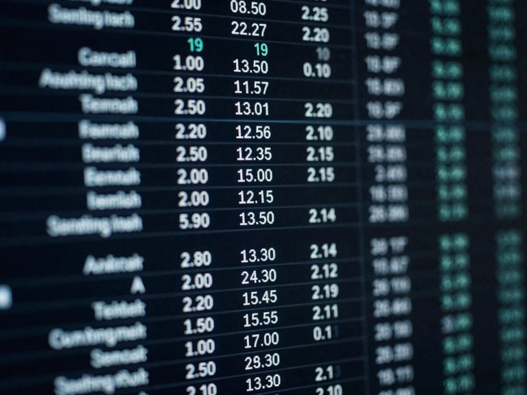 High-contrast close-up of a digital interface showing performance metrics, cool blue screen glow, sharp focus on data columns, desaturated dark tones.