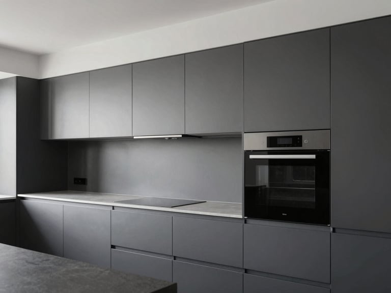 High-end modular kitchen interior with clean lines and integrated appliances, cool daylight, charcoal and steel gray palette.