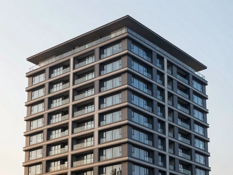 Modern high-end apartment building exterior during golden hour, clean architectural lines, professional editorial photography