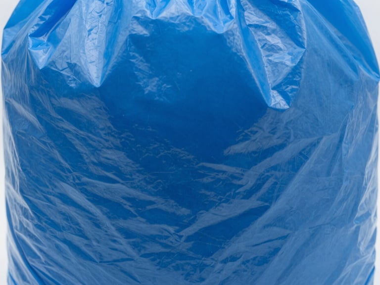 Close-up of thick, high-gauge royal blue plastic bag texture, studio light, sharp focus, macro lens.
