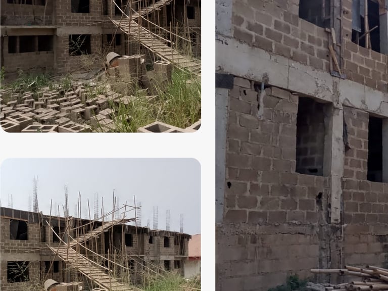 Multi-story concrete block residential building under construction with bamboo scaffolding and masonry supplies.