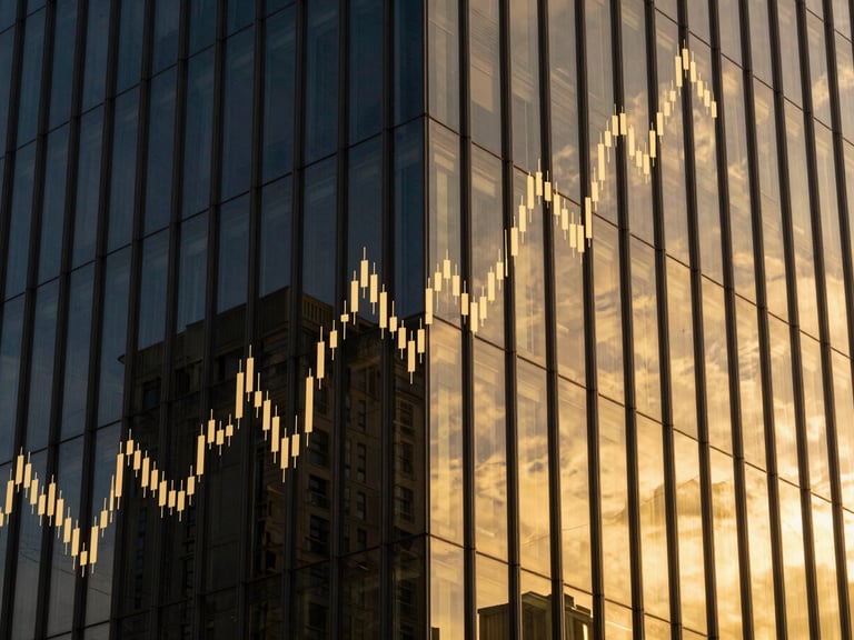 Abstract image of financial charts overlaid on a modern building facade, reflecting golden light, sharp focus.