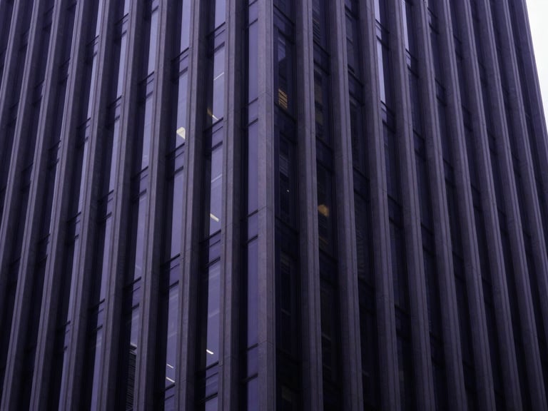 Wide architectural shot of a modern corporate skyscraper facade with clean geometric lines, diffused natural daylight, high contrast, deep navy tones, 35mm premium editorial photography