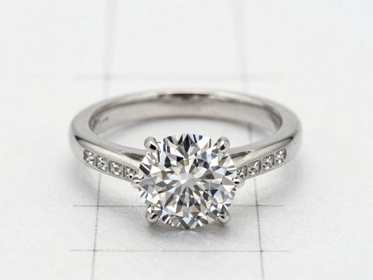 A precise graphite technical drawing of a diamond ring layout, showing micro-pave grid lines on archival vellum, soft diffused daylight, macro details