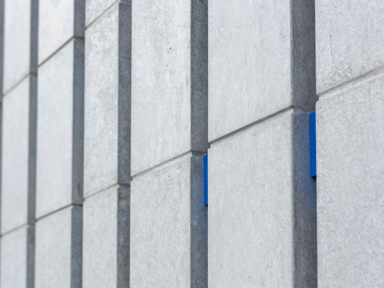 Ultra-sharp macro photograph of structured geometric patterns on a modern concrete wall, cool daylight, minimalist composition