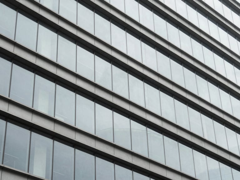 Abstract geometric pattern of architectural lines and structured glass reflecting daylight, desaturated cool tones.