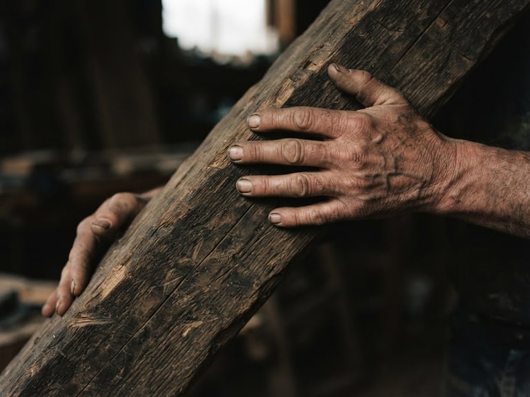 Intimate close-up of weathered hands holding a heavy wooden beam, natural overcast daylight, moody documentary style, 35mm film grain