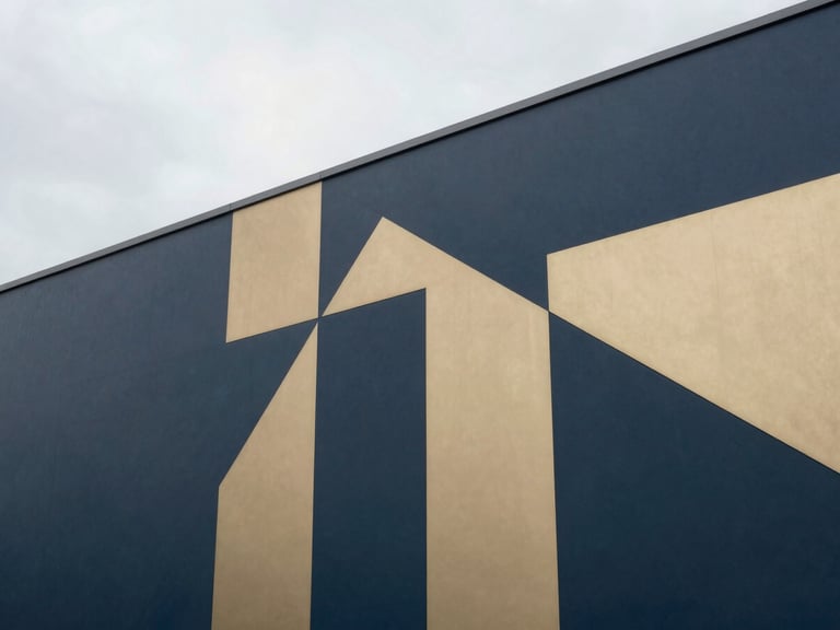 Modern office interior with abstract geometric patterns, clean lines, soft overcast daylight, muted navy and champagne gold tones, sharp focus, 35mm lens
