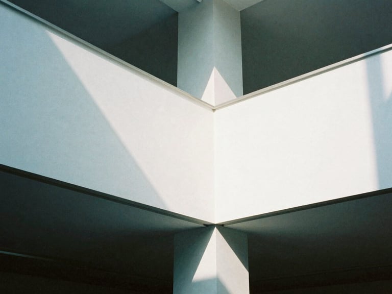 Close-up of a modern corporate interior, clean lines, stark white walls, cool daylight, sharp shadows, 35mm film