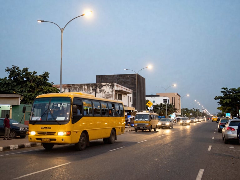 Wide environmental shot of the bustling Lagos commercial district at dusk, streetlights starting to glow, a yellow Danfo bus in motion on the left third, realistic 35mm documentary style.