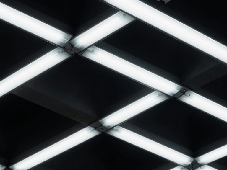 Abstract geometric schematic with deep shadows, emphasizing complex interconnections, cold fluorescent lighting, technical focus.