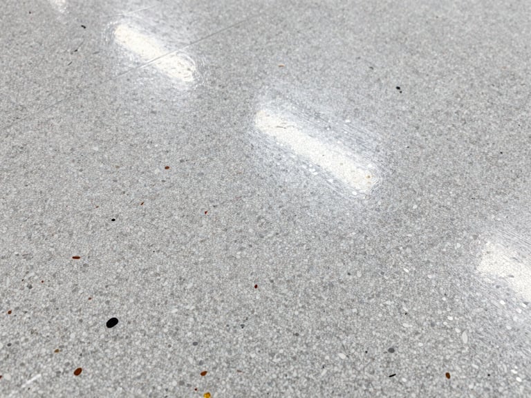 Macro shot of a seamless vinyl flake floor texture, showing various colored flakes embedded in a clear topcoat, high-contrast lighting, sharp focus.