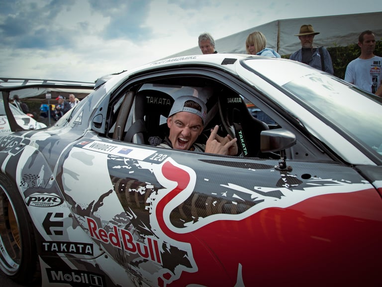 Mad Mike greeting me at the Goodwood Festival of Speed whilst sitting in his Mazda RX7 in 2015