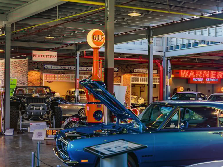 Interior of NATMUS with blue car and gulf oil sign