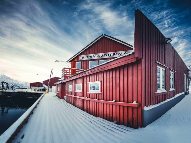Winter view of Bjørn Gjertsen fish warehouse in Reine, Lofoten– part of the local fishing heritage