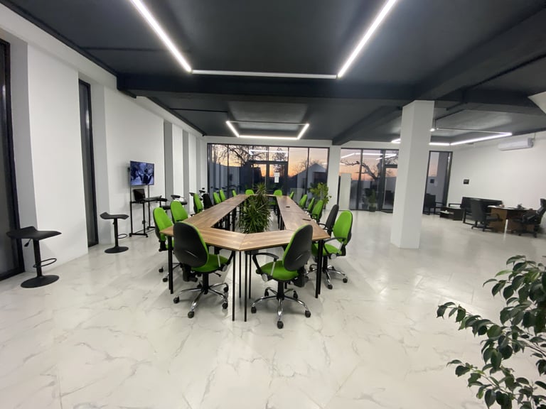 a conference room with a long table and chairs