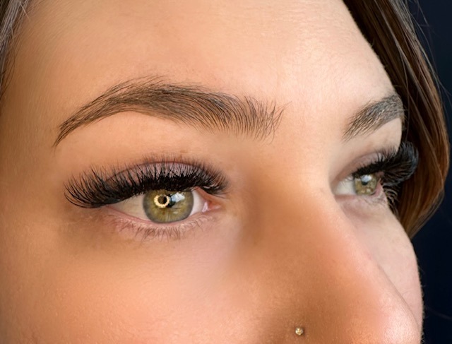 Signature lash extensions, balanced and polished, in Bird Rock