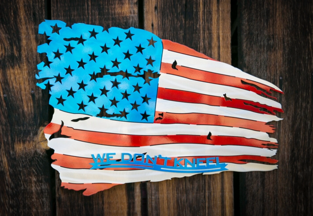 a metal sign with a flag on it