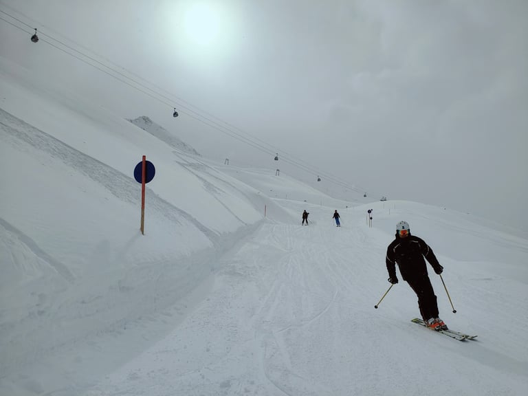 a person skiing down a snowy slope
