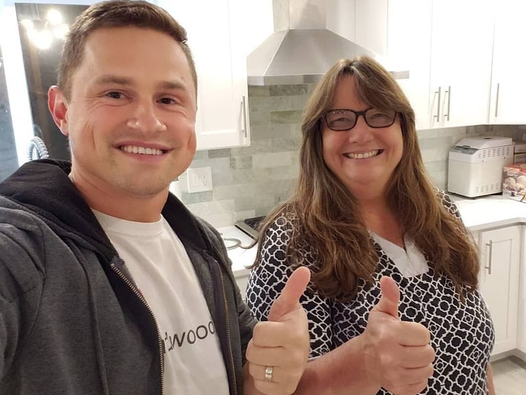 Water damage home restoration. Kitchen remodel featuring custom stained hardwood floors in Mill Creek