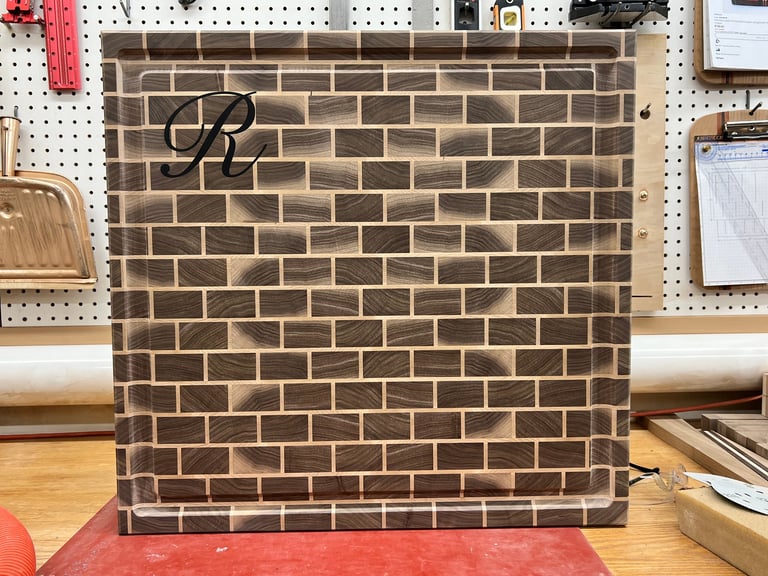 24" x 24" Brick Style. Black Walnut with Hard Maple grout. Personalized with Black Graphite epoxy.