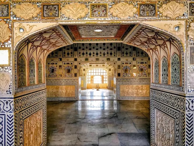 See the famous Sheesh Mahal inside Amber Fort Jaipur, a stunning mirror palace known for its intricate glass work.