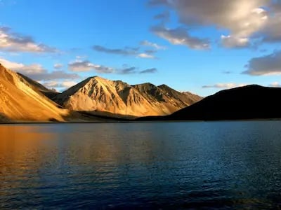 Pangong Tso Lake surrounded by mountains in Ladakh