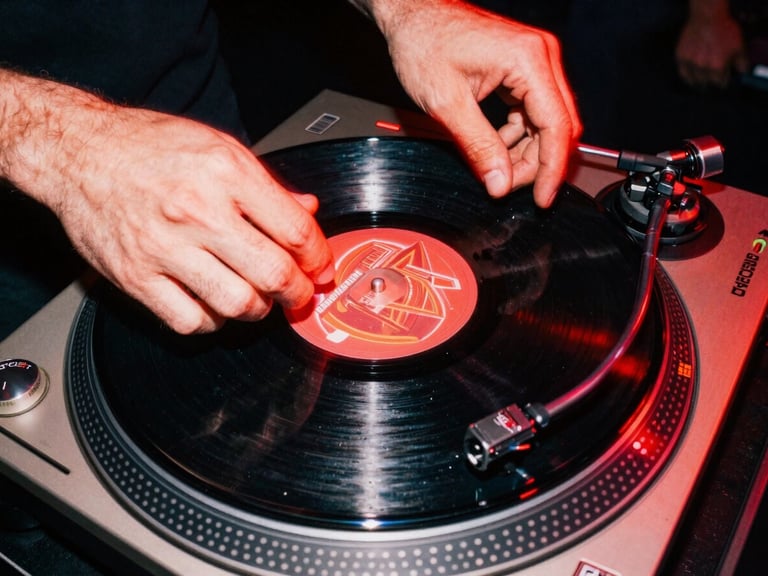 Macro close-up of hands spinning vinyl on a technics turntable, harsh direct flash photography, neon red glow, gritty 90s street aesthetic.