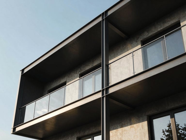 Low-angle architectural shot of a modern steel and concrete residential extension under sharp daylight, high-contrast shadows