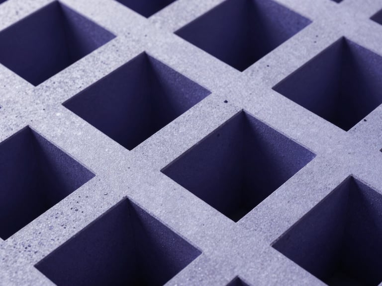 Macro shot of high-end architectural geometry, interlocking concrete structures under precise cool studio light with deep indigo shadows.