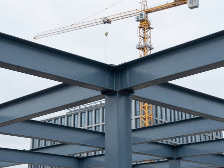 Close-up of structural steel beams being erected for a commercial office building in an urban Dutch setting, natural overcast daylight, cool blue and slate tones, sharp focus, 35mm, with a crane in the background