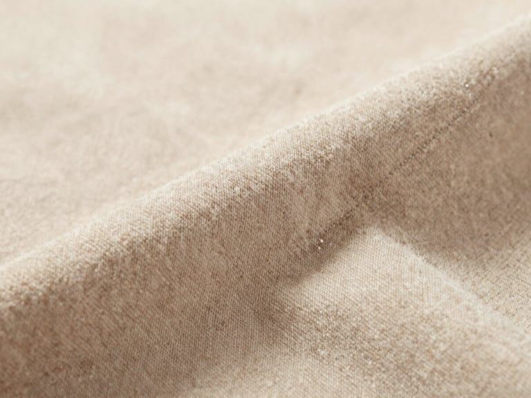 High-fidelity close-up of plush fabric textures and stitching details, soft natural daylight, macro lens focusing on fabric texture, warm neutral backdrop