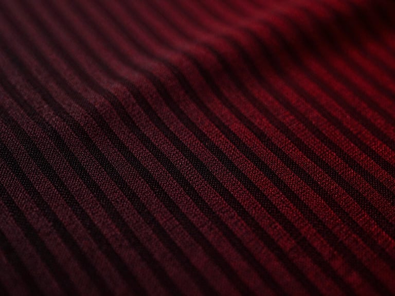 Macro shot of moisture-wicking fabric texture, showing intricate weave, dramatic high-contrast chiaroscuro lighting, sharp focus.