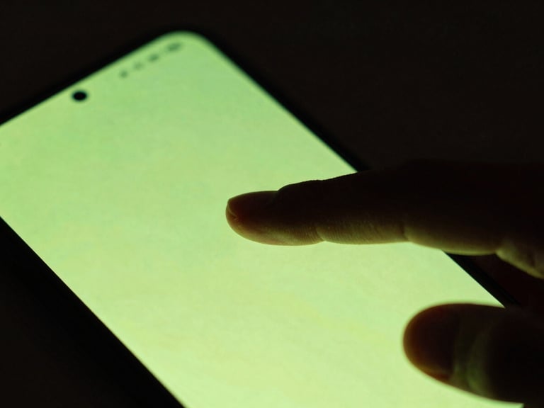 Extreme close-up of a finger tapping a sleek, glowing cyber-lime Android device screen, dark moody ambient background, shallow depth of field