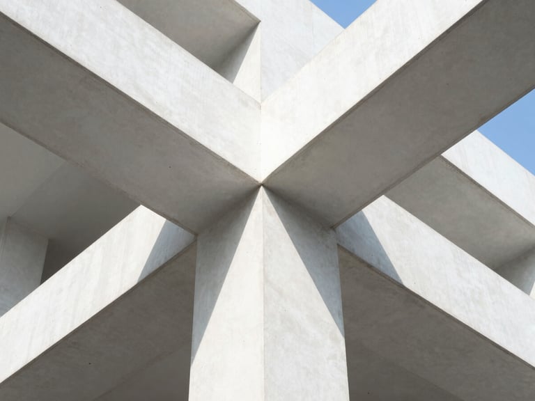 Abstract geometric concrete structure with sharp clean lines, bright high-key natural light, high contrast, 35mm lens.