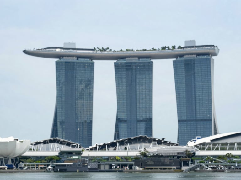 Modern Singapore skyline with Marina Bay Sands under bright daylight, clean editorial photography, shallow depth of field