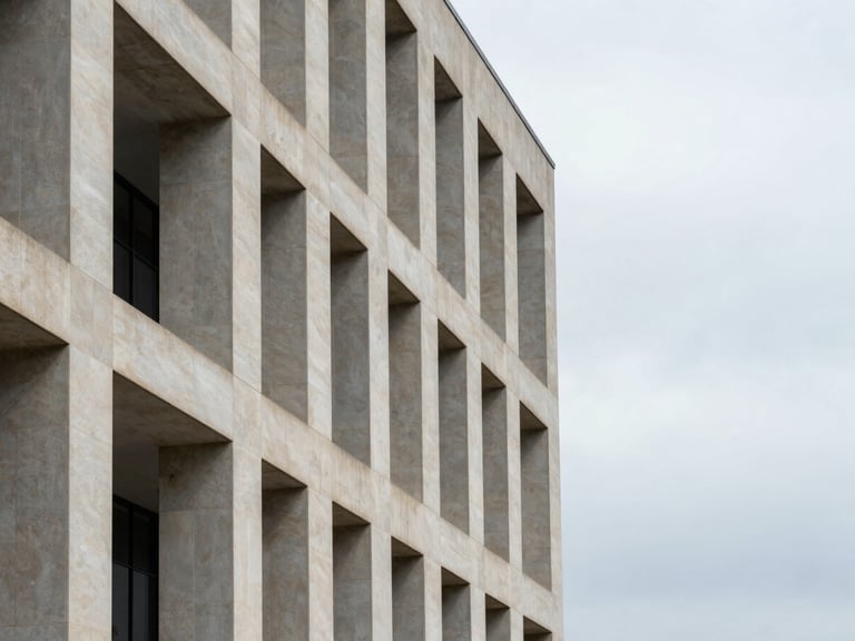 Abstract architectural detail of a modern limestone courthouse facade, sharp shadows under overcast daylight, clean geometric lines, generous negative space on the right third.