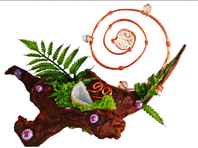 Whimsical crystal sculpture with copper wire spiral, geode, and moss on driftwood.