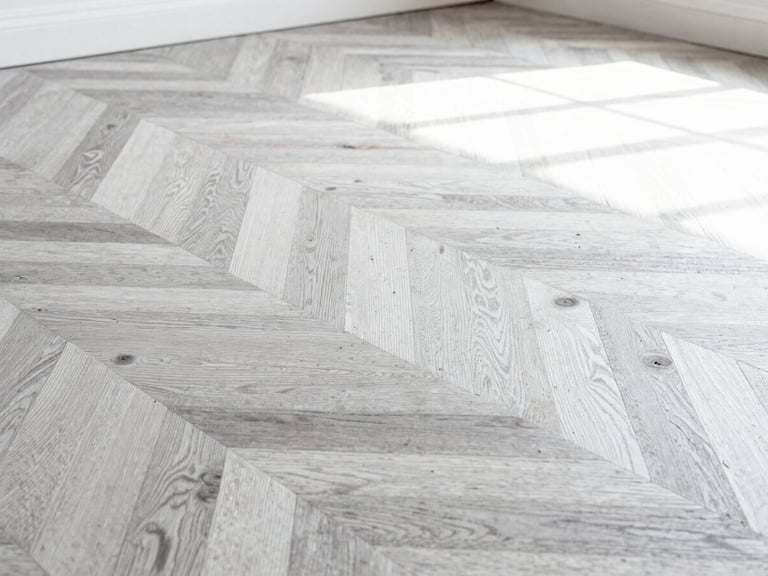 Macro close-up of a master craftsman hand-restoring historic oak parquet flooring in a Parisian apartment, soft natural side lighting, dust particles visible in sunlight, extreme precision focus